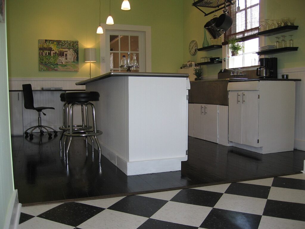 15 Porte - New Orleans kitchen after renovation. Standing in the breakfast area looking into the kitchen- it couldn't look more different.